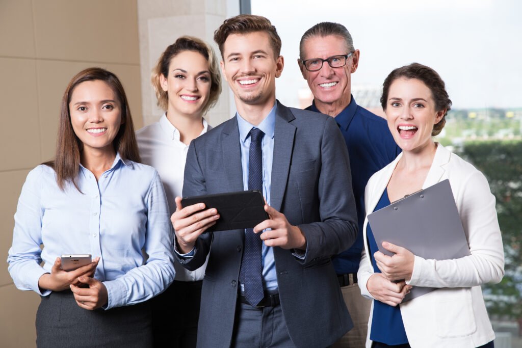 smiling business team standing in conference room